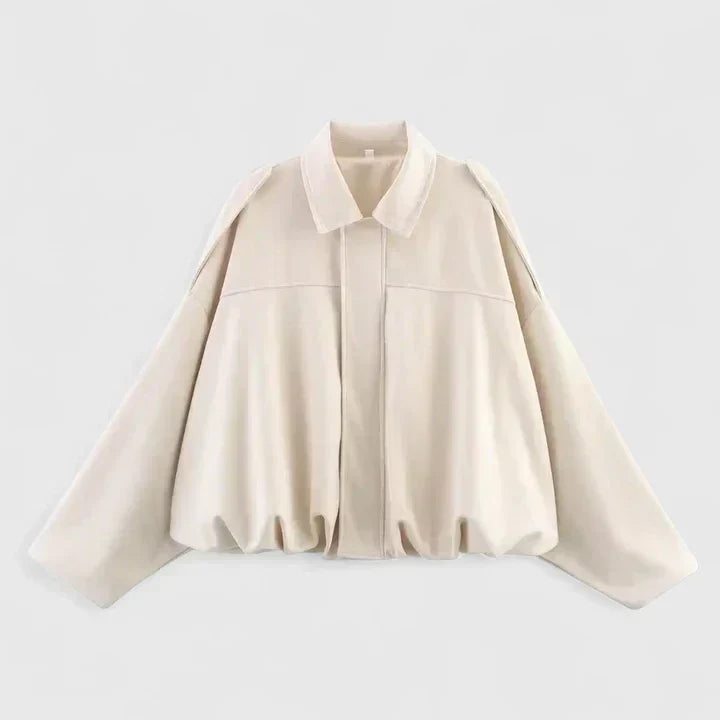 A woman wearing a classic versatile jacket, styled for a smart-casual day out.