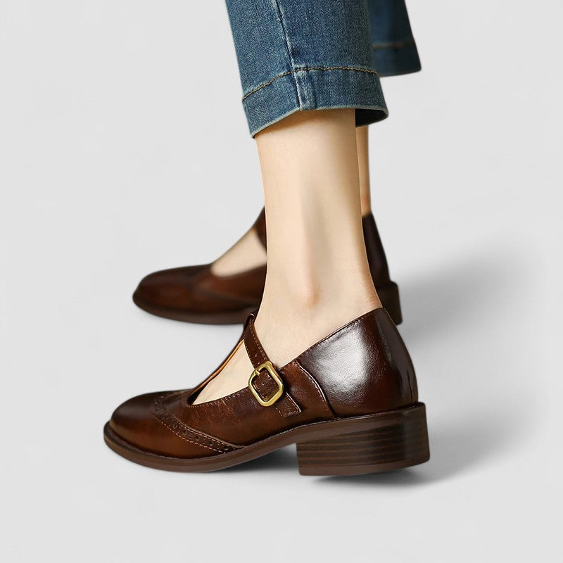 A woman in beige T-strap Mary Jane shoes, comfortable and balanced on a busy day.