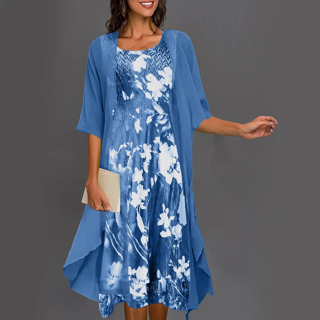 A woman wearing a flowing layered dress set with a printed inner dress, graceful and elegant.