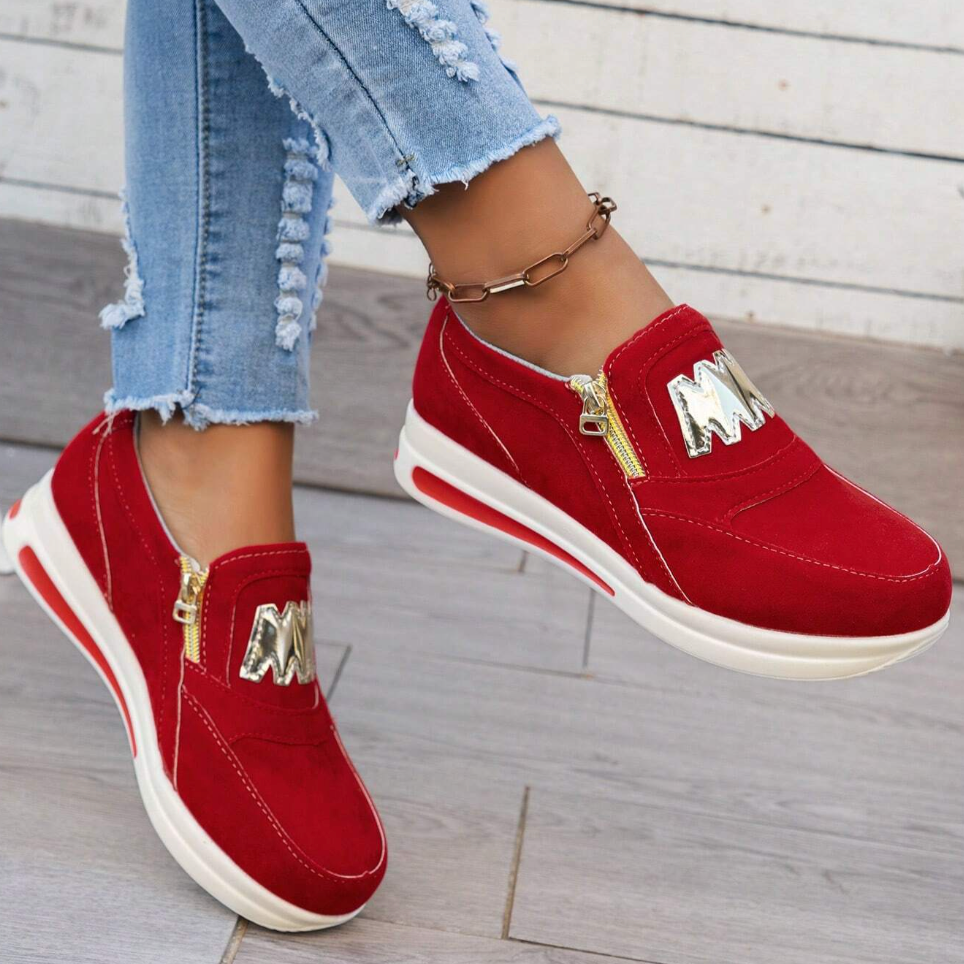 A woman wearing cushioned side-zip sneakers with a relaxed everyday outfit