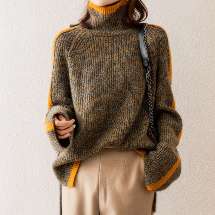 A woman wearing a softly textured everyday sweater with a relaxed modern line.