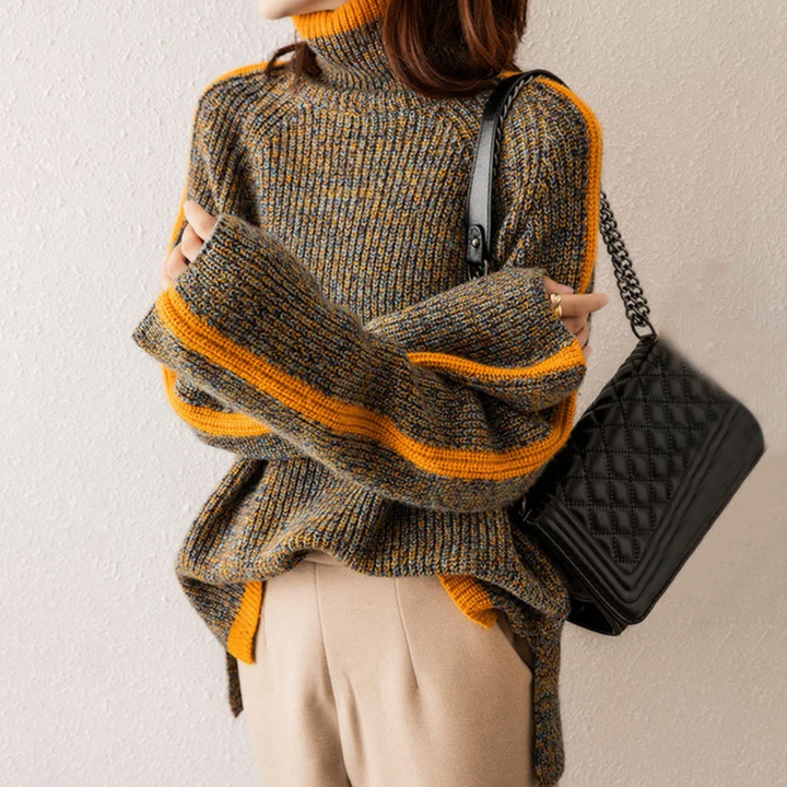 A woman wearing a softly textured everyday sweater with a relaxed modern line.