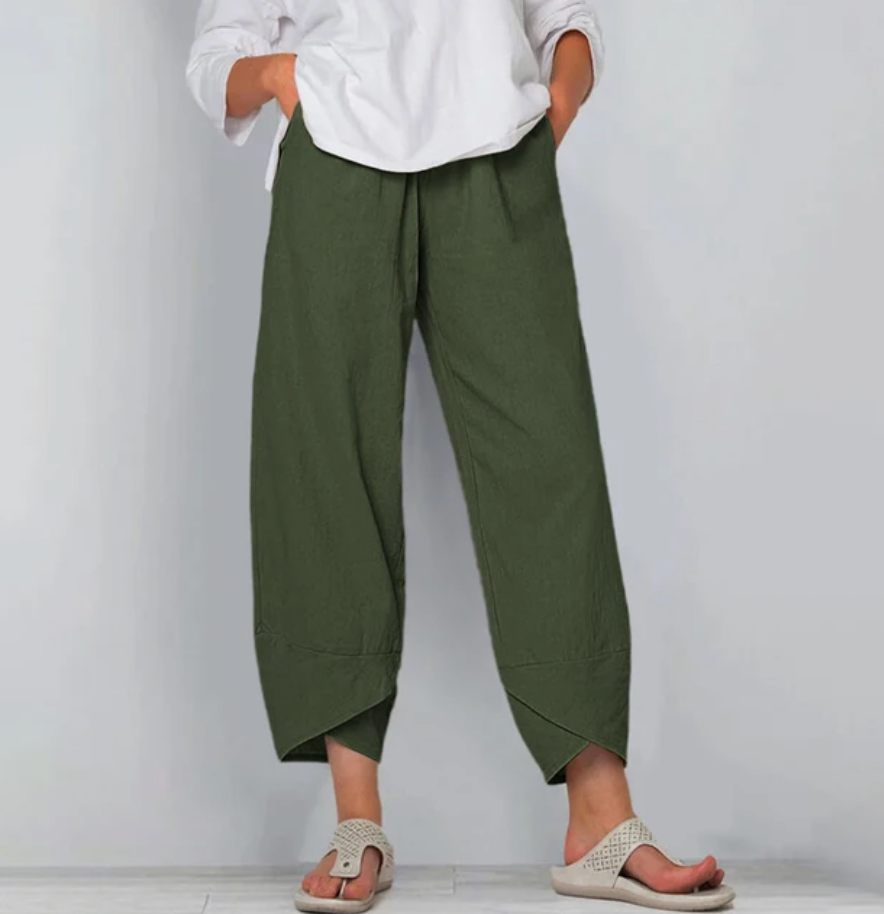 A woman wearing lightweight plain pants with an elastic waist and handy pockets.
