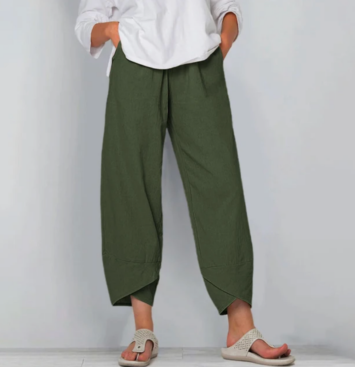A woman wearing lightweight plain pants with an elastic waist and handy pockets.