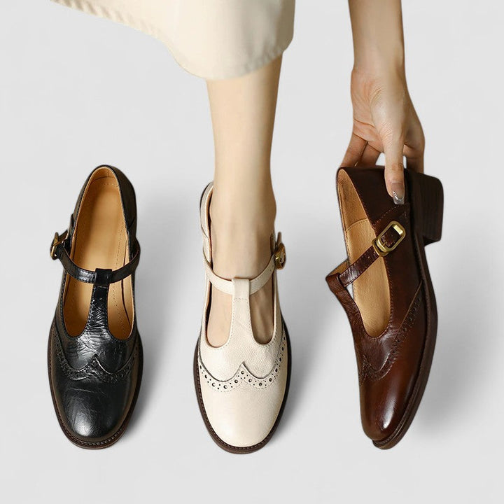 A woman in beige T-strap Mary Jane shoes, comfortable and balanced on a busy day.