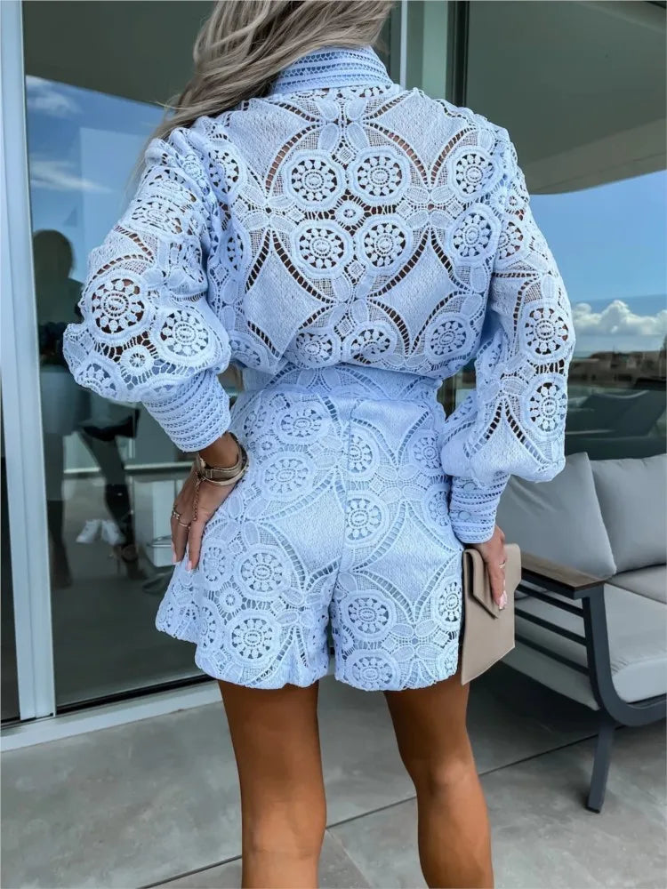 A woman wearing an elegant two-piece set with delicate openwork detailing