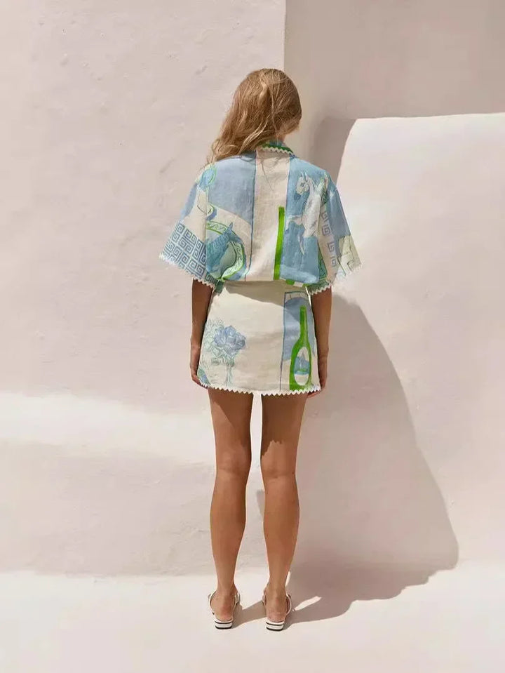 A woman wearing a patchwork print short-sleeve top and matching tie-waist shorts on a sunny day