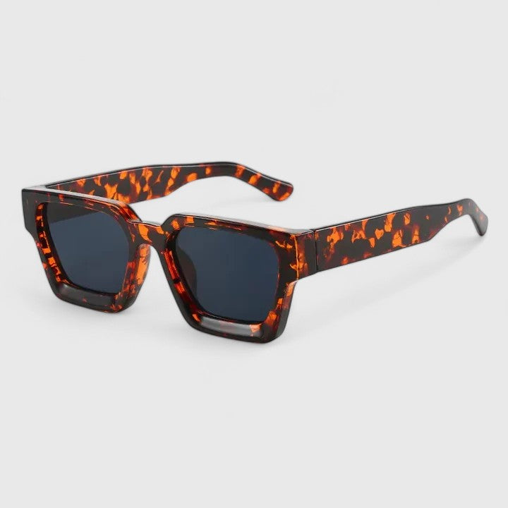 A woman out for the day wearing classic square sunglasses, relaxed and stylish in the sun.