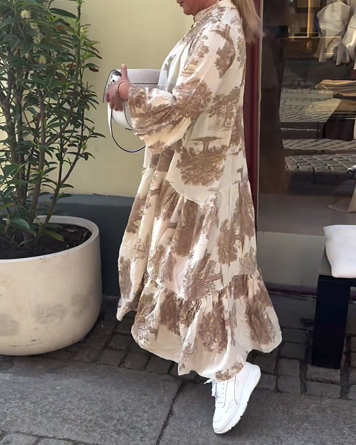 Woman wearing the Sylvie flowing maxi dress with a delicate print and V-neckline, the skirt moving softly as she walks.