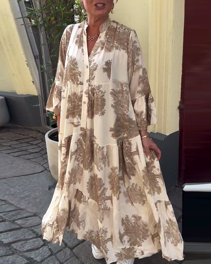 Woman wearing the Sylvie flowing maxi dress with a delicate print and V-neckline, the skirt moving softly as she walks.