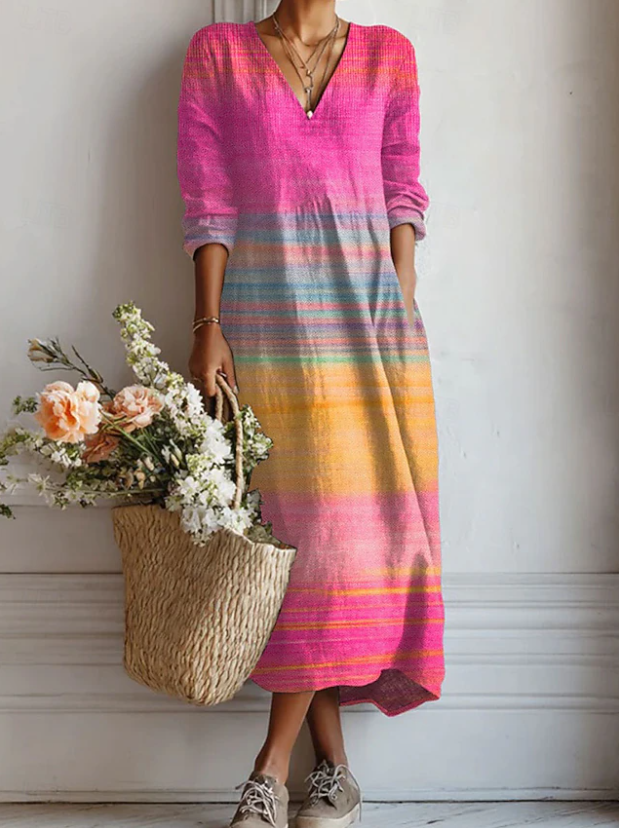 A woman wearing an elegant, light day dress as she enjoys a relaxed afternoon out.