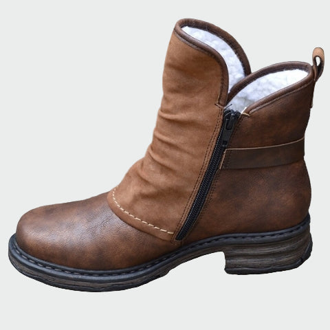 Woman wearing warm brown winter boots on a frosty morning walk.
