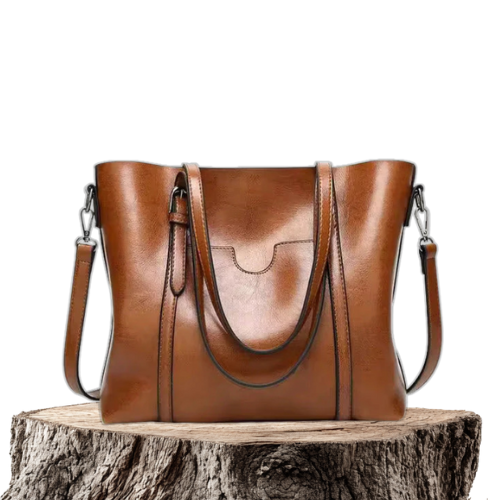 A woman carrying a structured luxe handbag on her arm while out for the day.