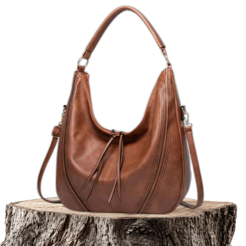 A woman holding a soft grey casual handbag over her shoulder on a relaxed day out.