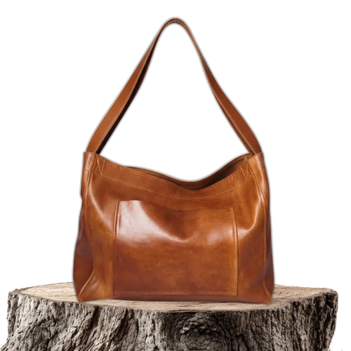A woman carrying a roomy dark brown everyday handbag on her shoulder during a busy day.