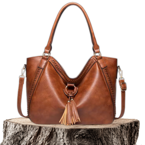 A woman carrying a soft tasselled shoulder bag while out for a walk in town.