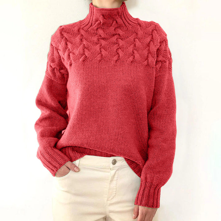 A woman wearing a warm roll-neck sweater, cosy and elegant on a cold winter day.