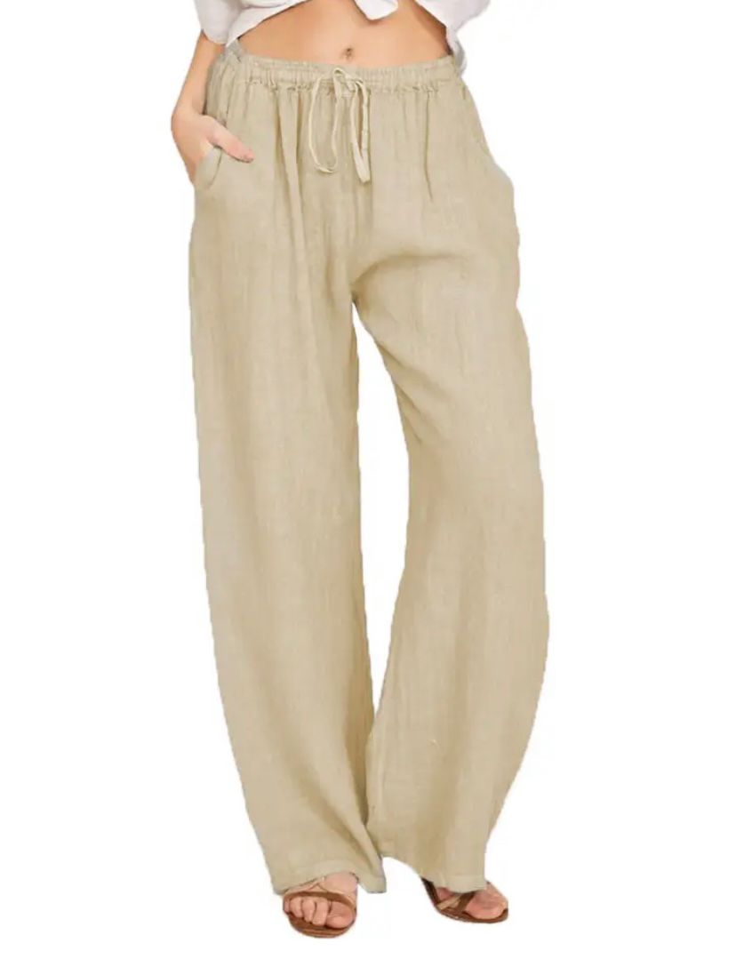 Woman wearing lightweight summer pants with a light blouse, walking on a warm day.