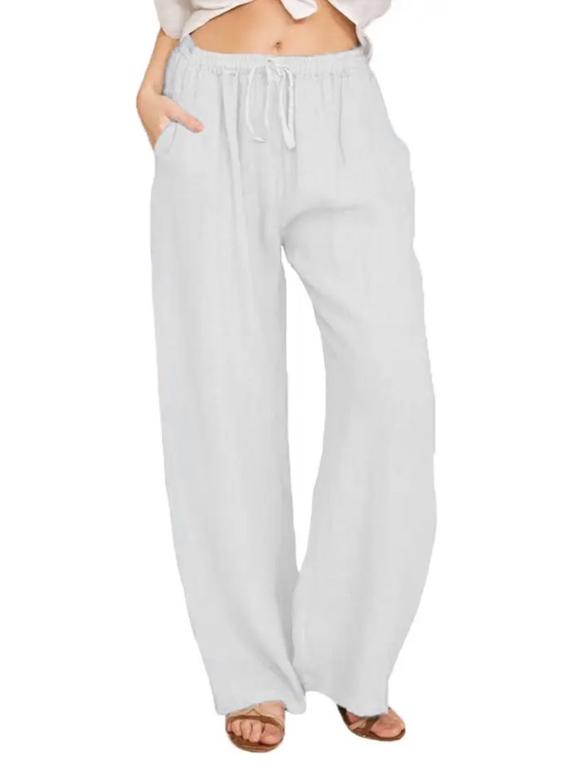 Woman wearing lightweight summer pants with a light blouse, walking on a warm day.