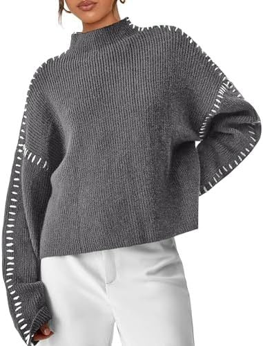 A woman wearing an oversized mock-neck sweater with whipstitch detailing, cosy and stylish.