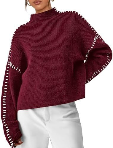 A woman wearing an oversized mock-neck sweater with whipstitch detailing, cosy and stylish.