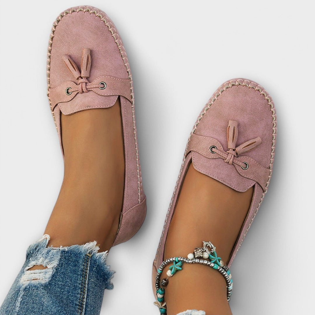 A woman wearing classic loafers on an easy day in town.