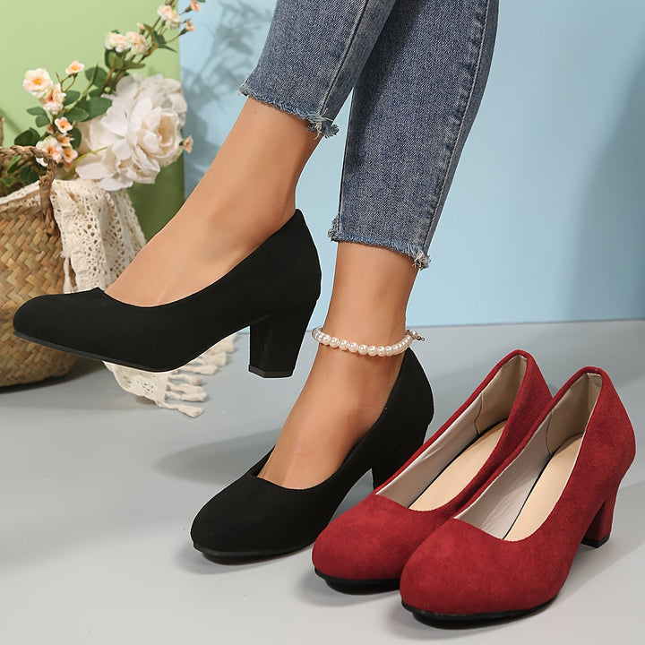 A woman in sturdy block heels standing comfortably and confidently through a long day.