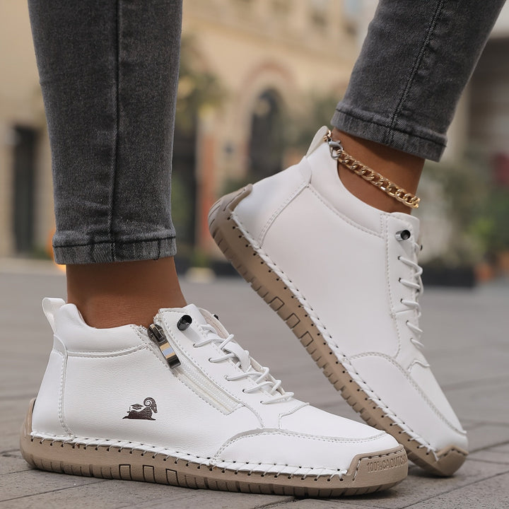 A woman standing comfortably in wide-fit therapeutic comfort shoes