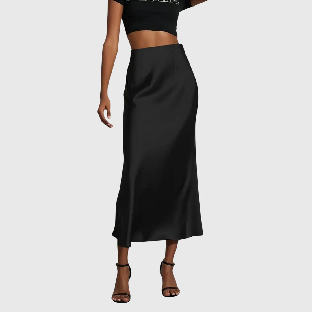 A woman in a fitted fishtail skirt with a flared hem, styled elegantly for a special occasion.