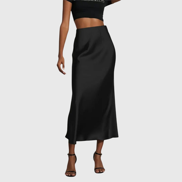 A woman in a fitted fishtail skirt with a flared hem, styled elegantly for a special occasion.