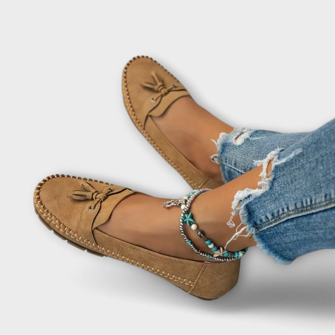 A woman wearing classic loafers on an easy day in town.