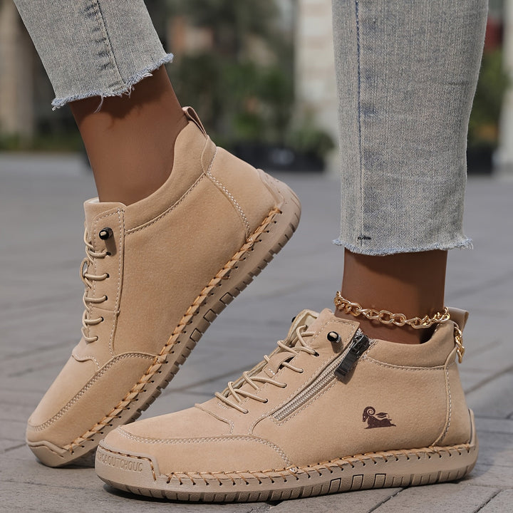 A woman standing comfortably in wide-fit therapeutic comfort shoes