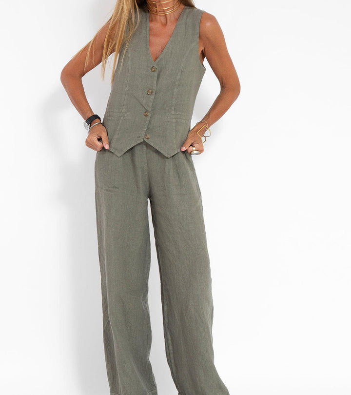 A woman wearing a tailored waistcoat with flowing wide-leg pants