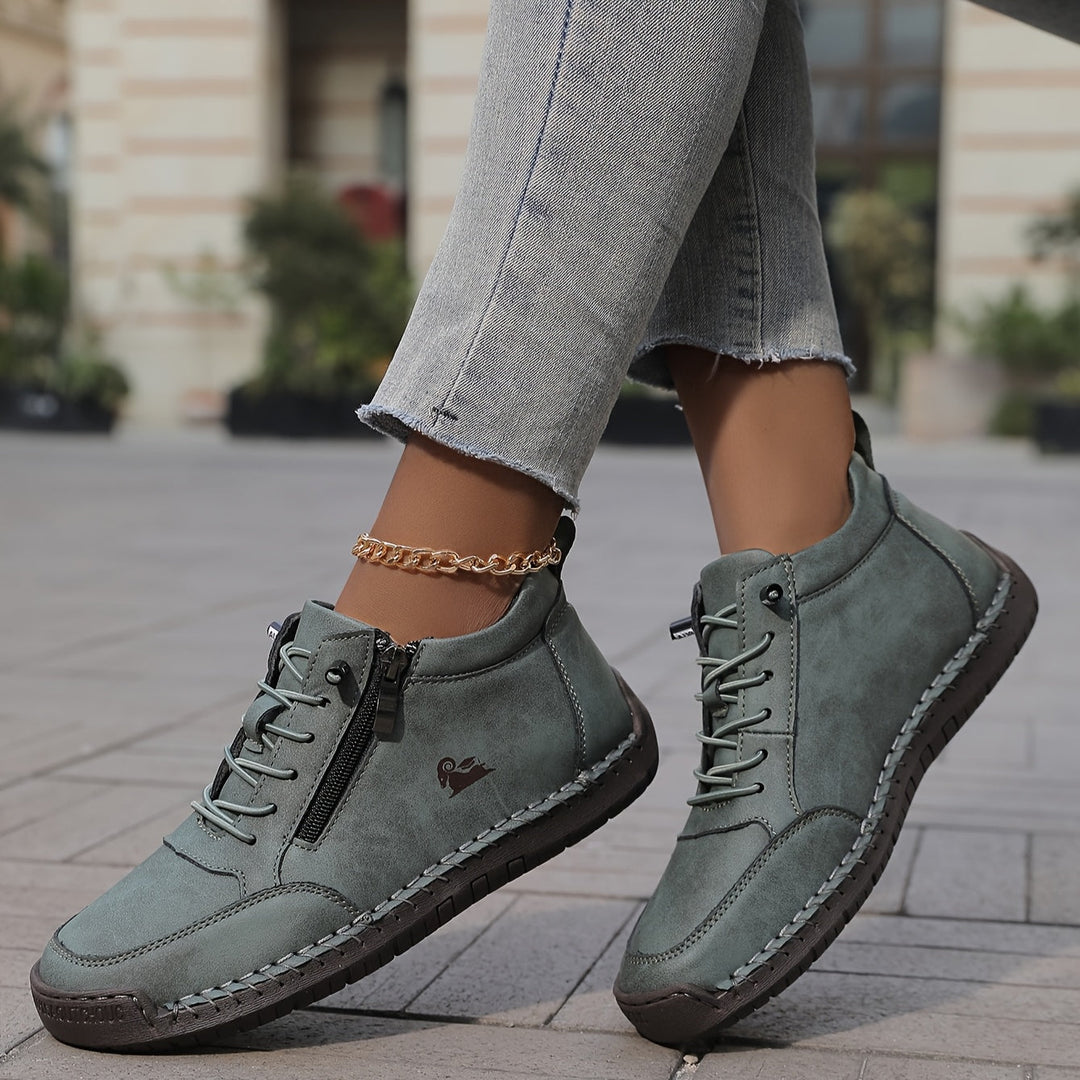 A woman standing comfortably in wide-fit therapeutic comfort shoes