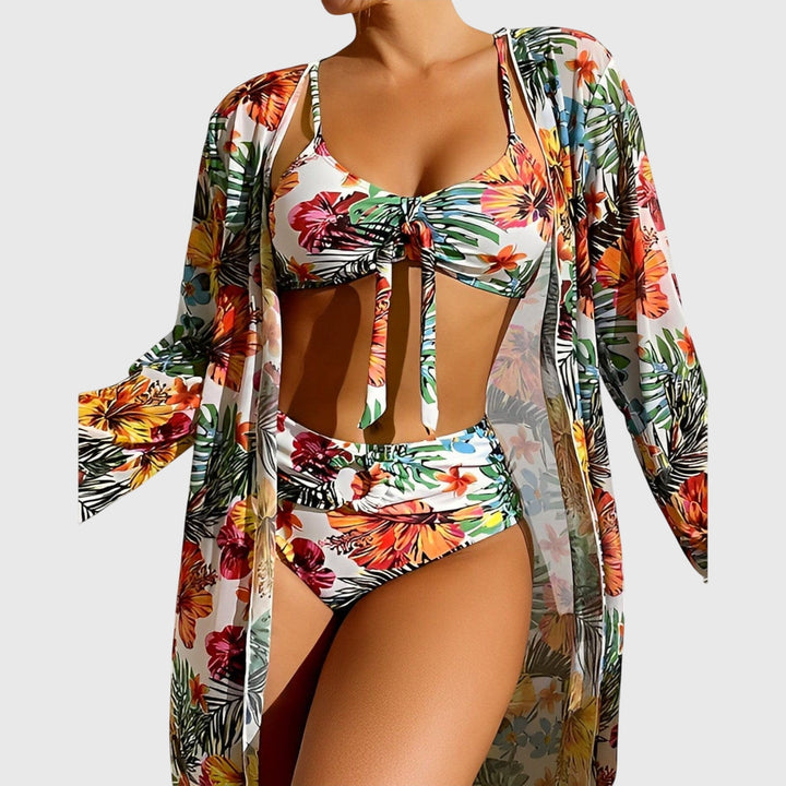 A woman by the pool in a matched printed bikini set, relaxed and confident in the summer sun.