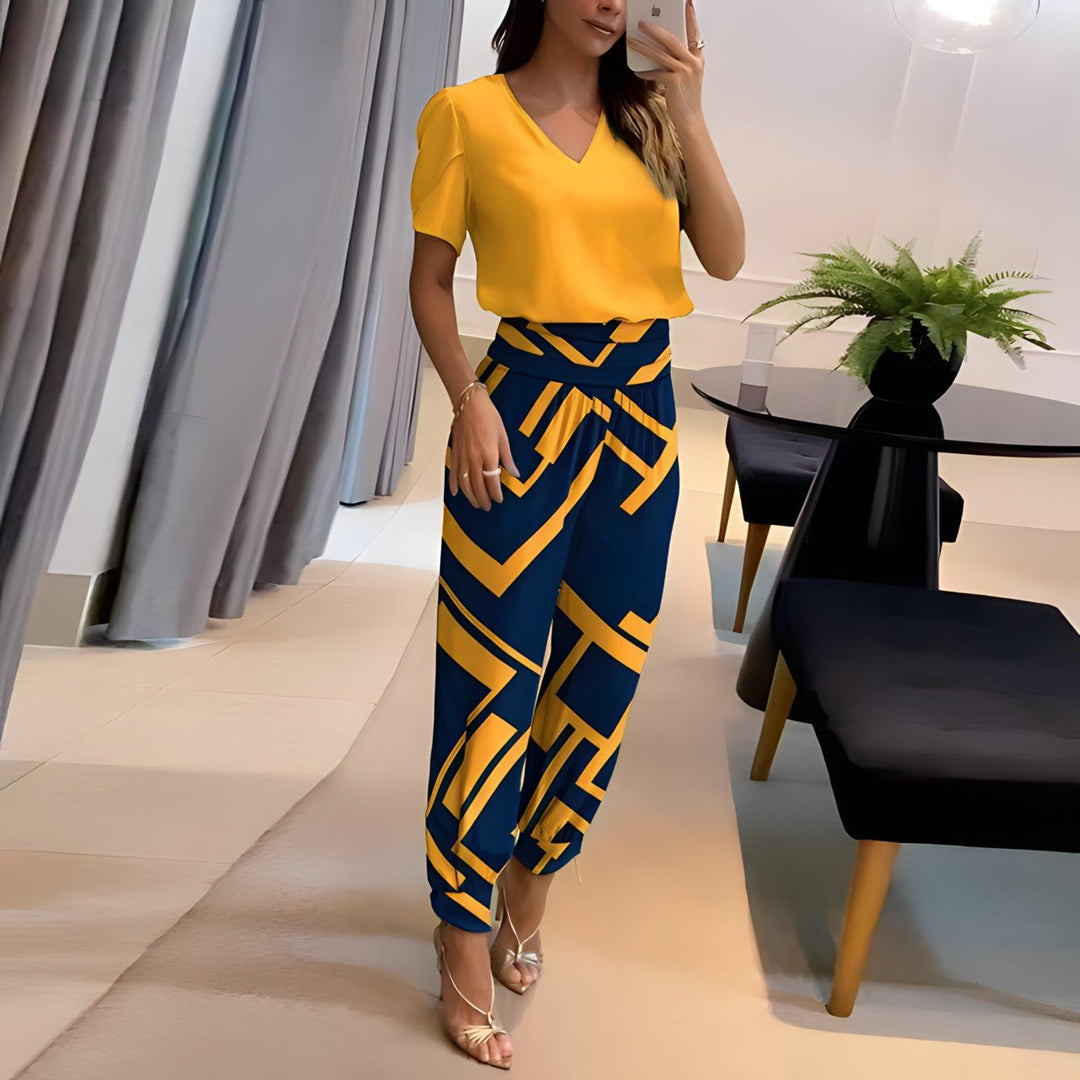A woman wearing a plain V-neck top with geometric print slim pants, chic and comfortable.