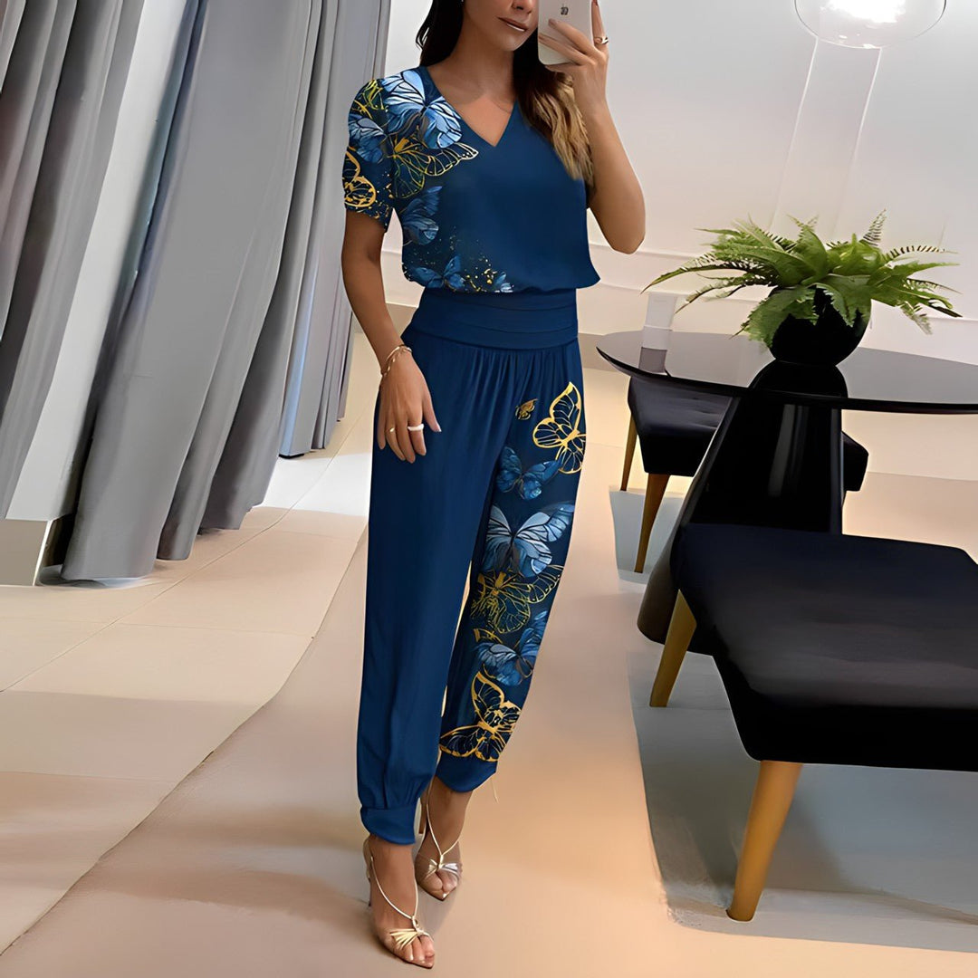 A woman wearing a plain V-neck top with geometric print slim pants, chic and comfortable.