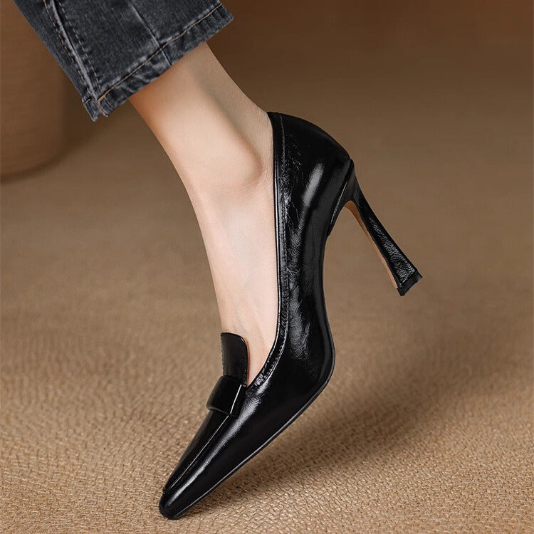 A woman in pointed refined heels stepping out confidently to a festive gathering.