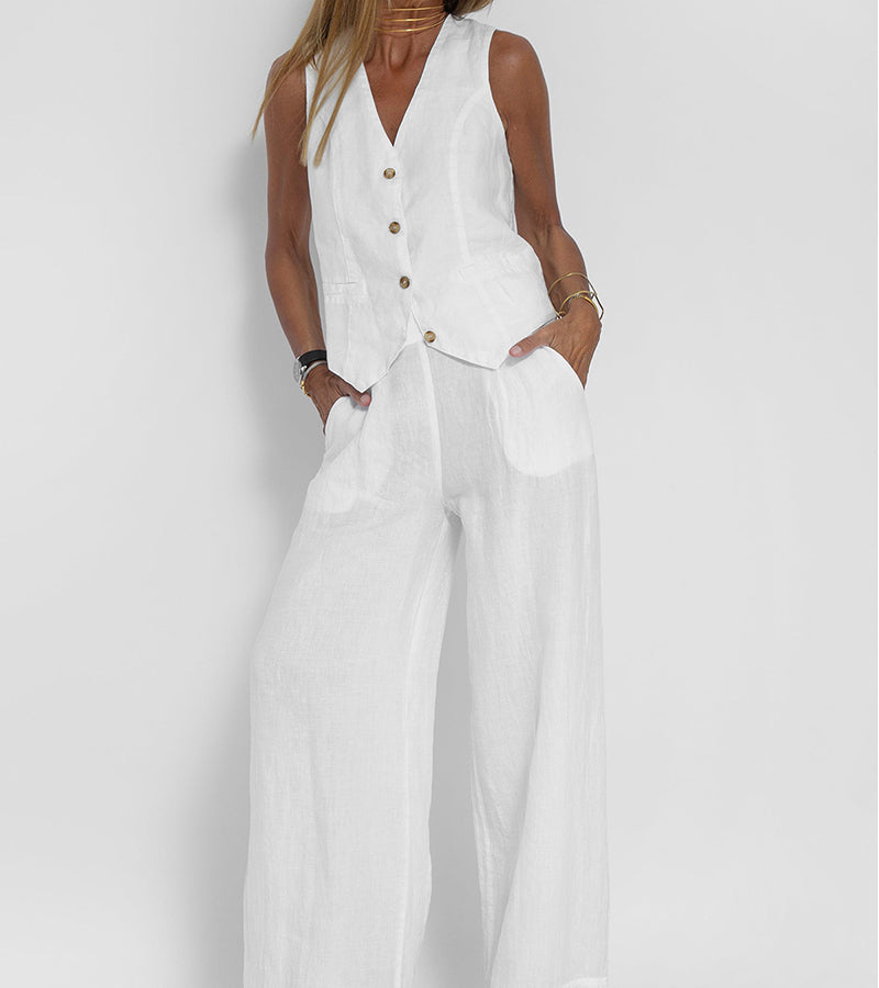 A woman wearing a tailored waistcoat with flowing wide-leg pants