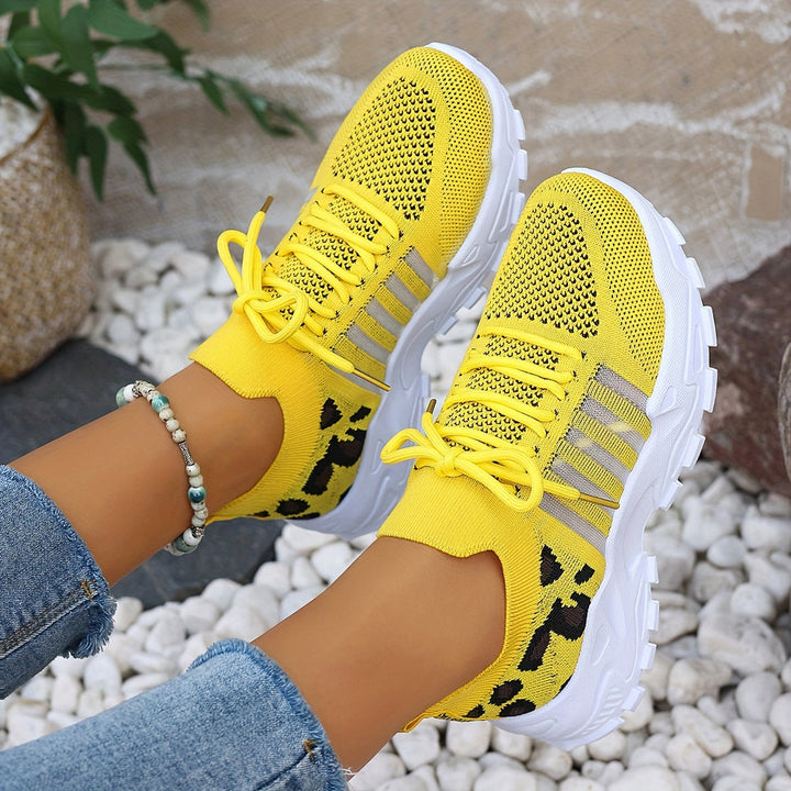 A woman walking in light, breathable comfort sneakers on a warm day.