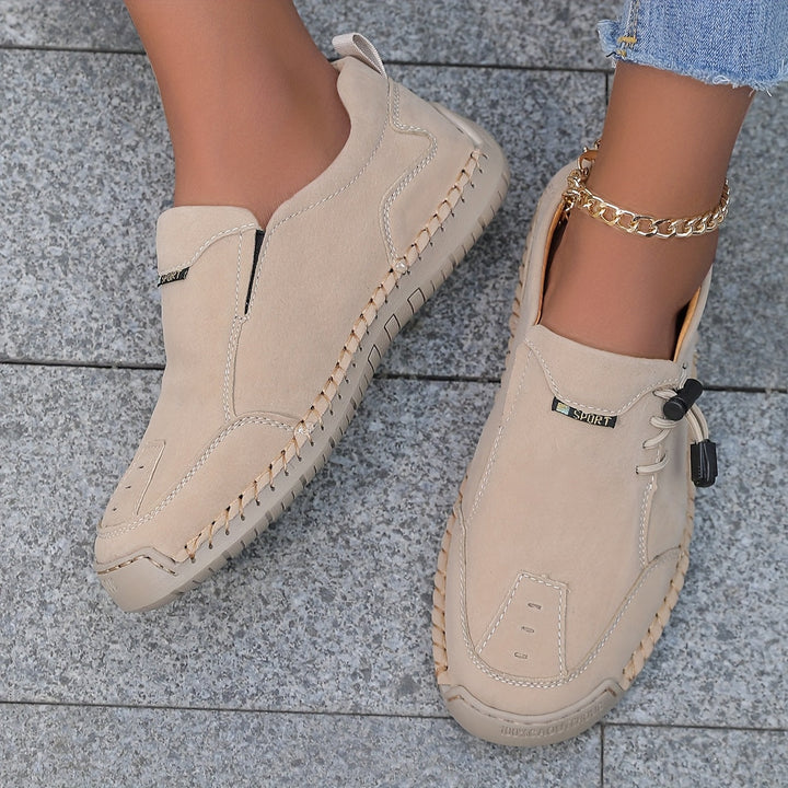 A woman walking smoothly in soft, supportive therapeutic walking shoes.
