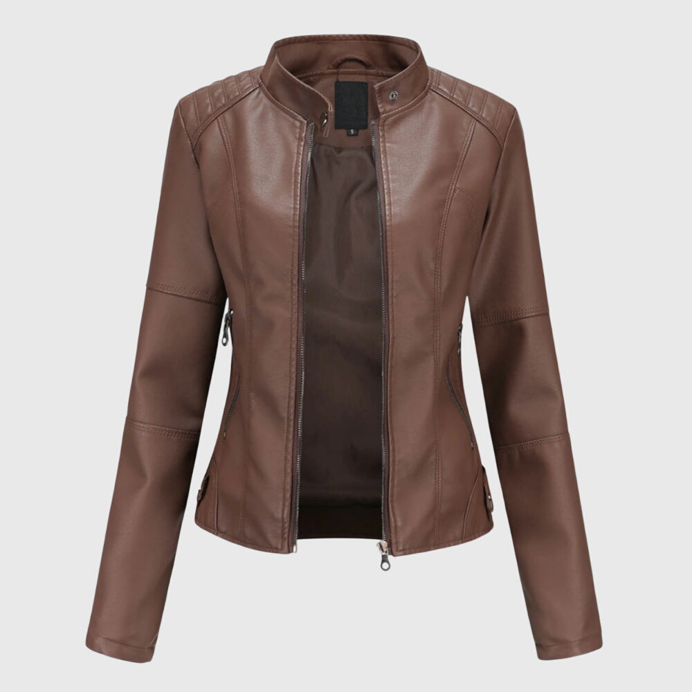 A woman wearing a fitted black moto jacket with a supple finish, styled for an evening out.