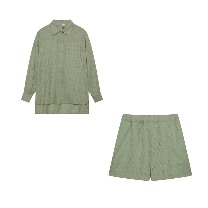 A woman wearing a classic button shirt with matching relaxed shorts, polished and easy.