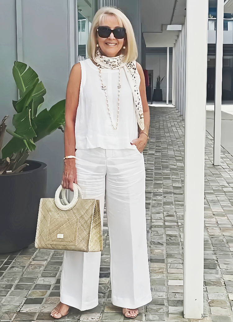 A woman wearing a chic minimal two-piece set with a soft, flattering silhouette.