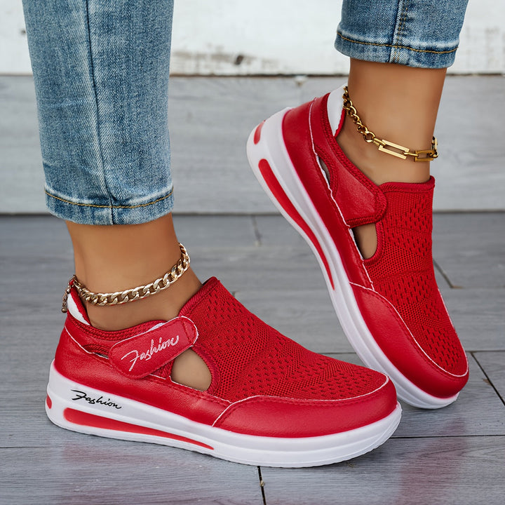 A woman slipping on breathable, cushioned slip-on sneakers with pants