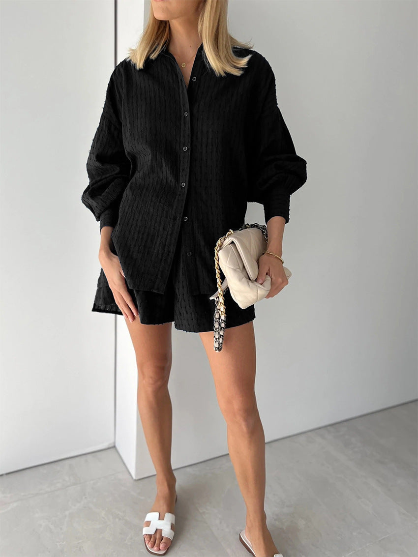 A woman wearing a classic button shirt with matching relaxed shorts, polished and easy.