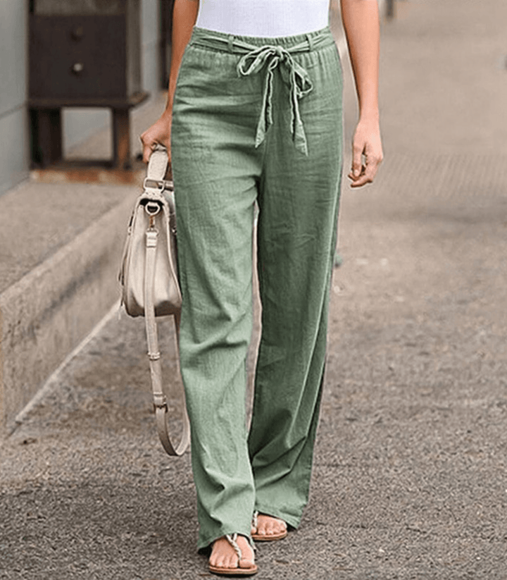 Woman wearing relaxed drawcord-waist pants with a smart top, out for the day.