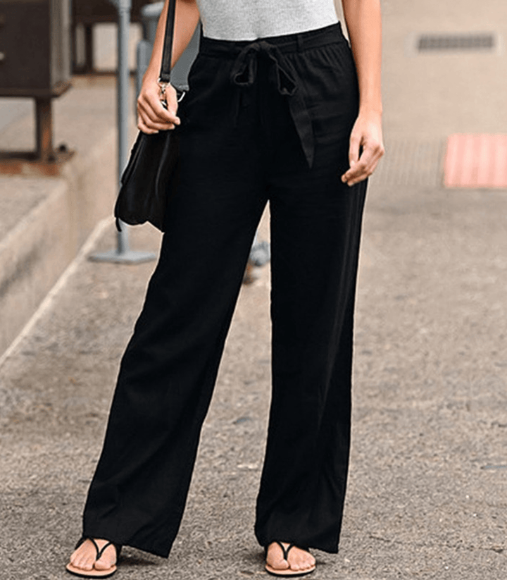 Woman wearing relaxed drawcord-waist pants with a smart top, out for the day.