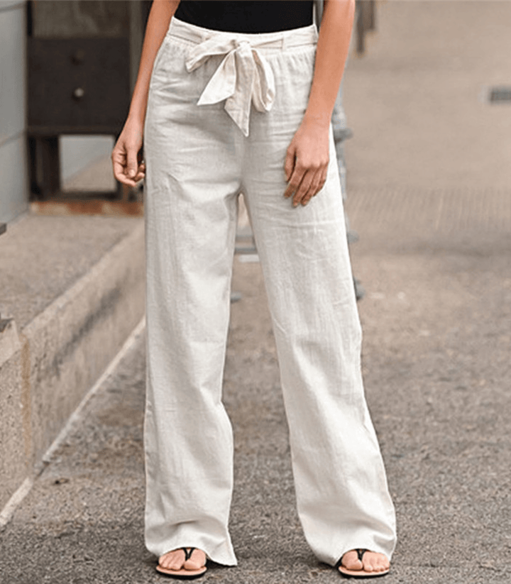 Woman wearing relaxed drawcord-waist pants with a smart top, out for the day.