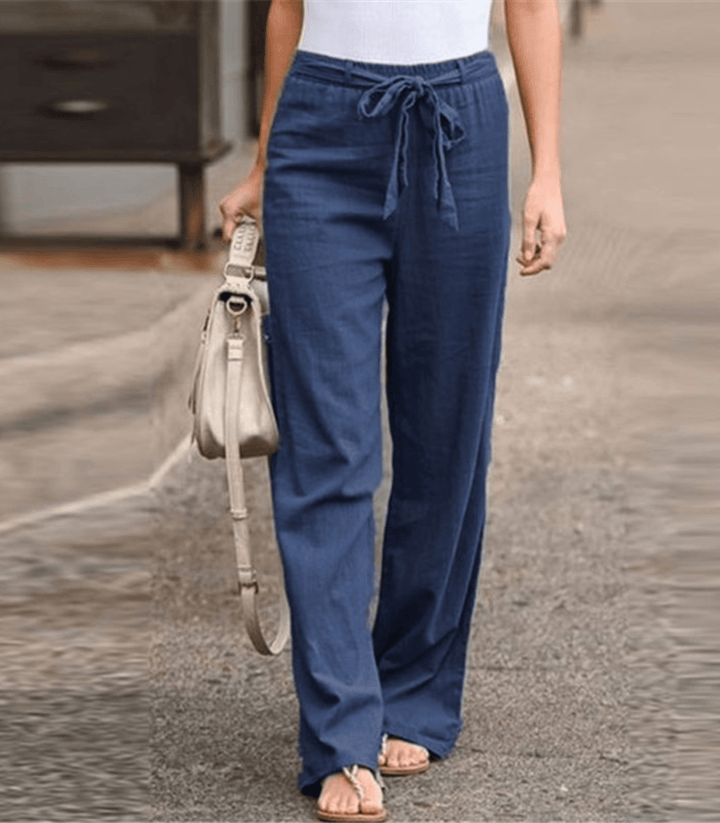 Woman wearing relaxed drawcord-waist pants with a smart top, out for the day.
